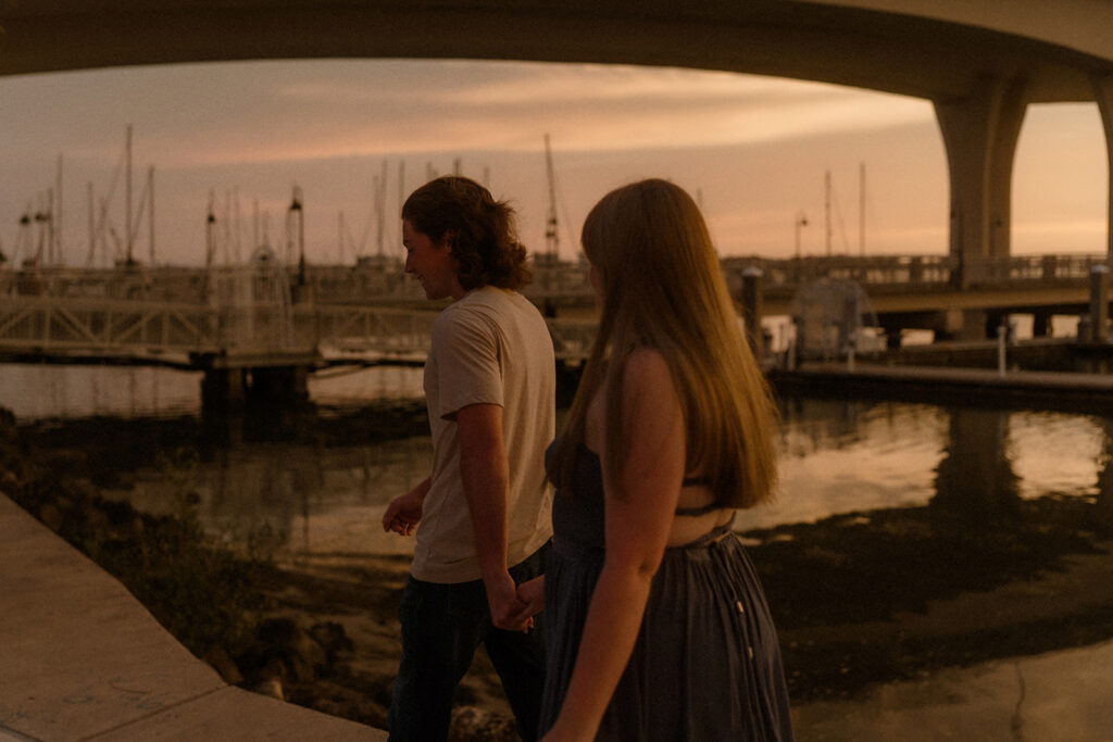 Moody blue hour photography session with tall buildings glowing in the background